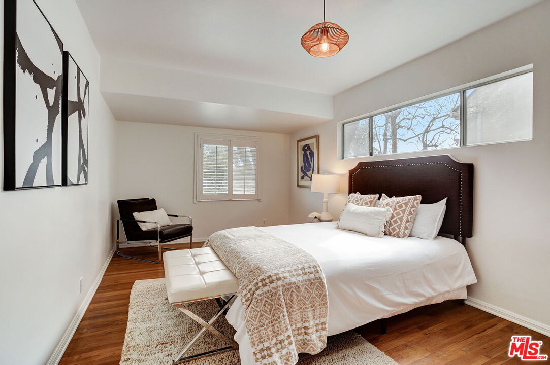 6215 West 77th Street Los Angeles, CA 90045 - Photo 13 of 23 a bedroom with a bed and a window
