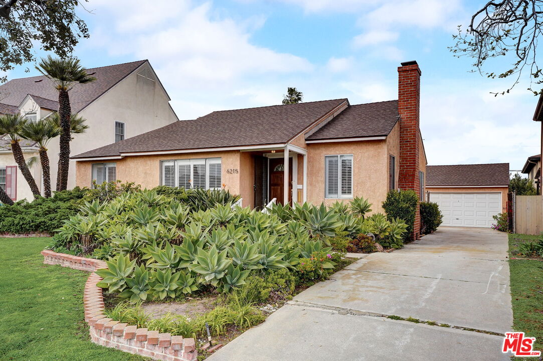 6215 West 77th Street Los Angeles, CA 90045 - Photo 2 of 23 front view of a house with a yard