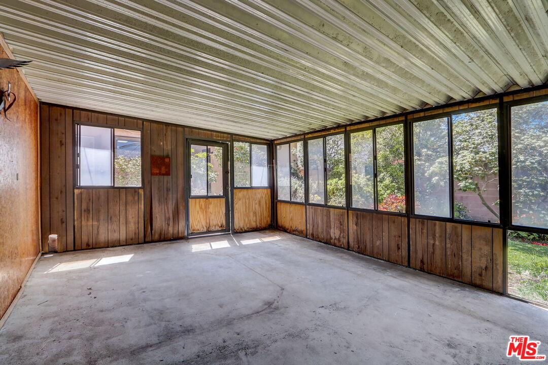 6215 West 77th Street Los Angeles, CA 90045 - Photo 22 of 23 an empty room with wooden floor and windows