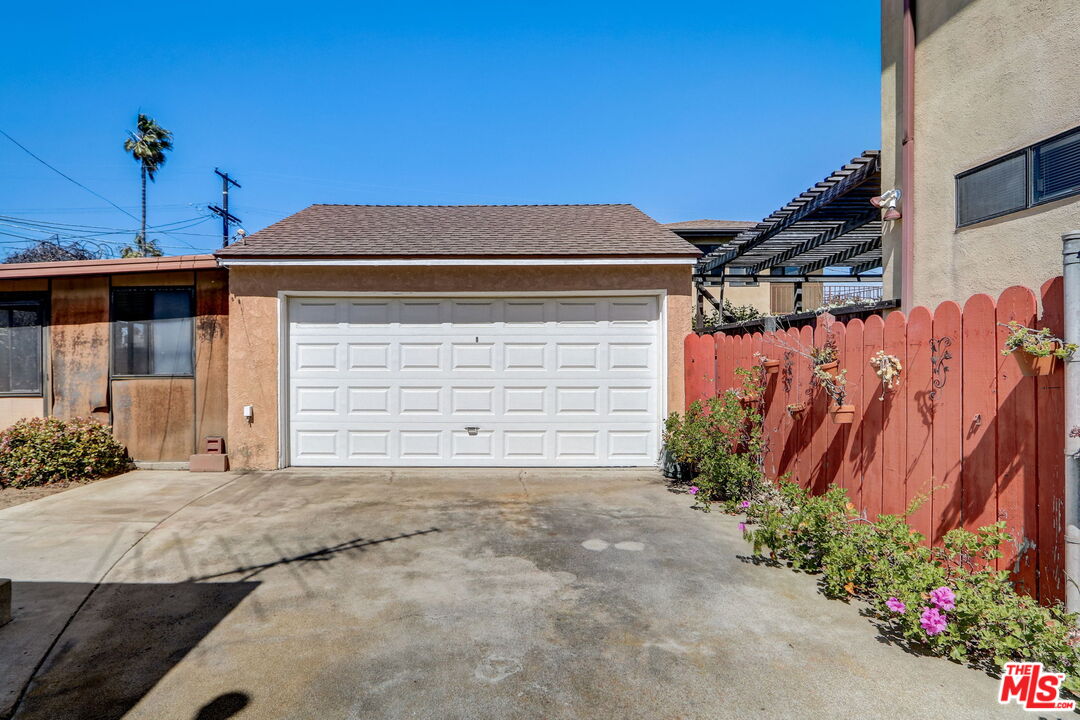 6215 West 77th Street Los Angeles, CA 90045 - Photo 23 of 23 a front view of a house with a garage