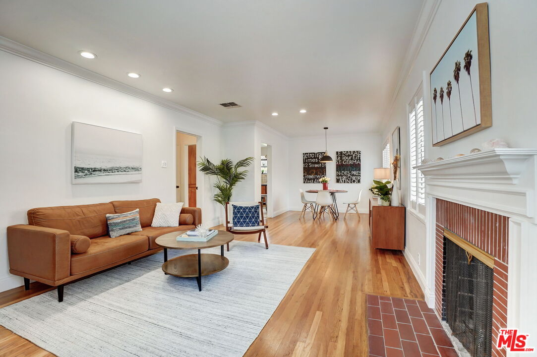 6215 West 77th Street Los Angeles, CA 90045 - Photo 3 of 23 a living room with furniture and a fireplace