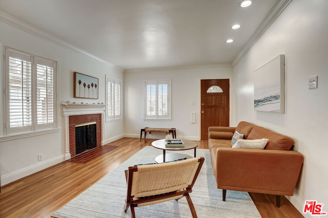 6215 West 77th Street Los Angeles, CA 90045 - Photo 4 of 23 a living room with furniture fireplace and window