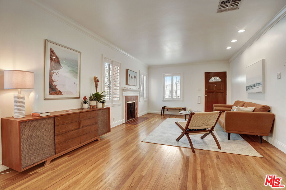 6215 West 77th Street Los Angeles, CA 90045 - Photo 5 of 23 a living room with furniture and a wooden floor
