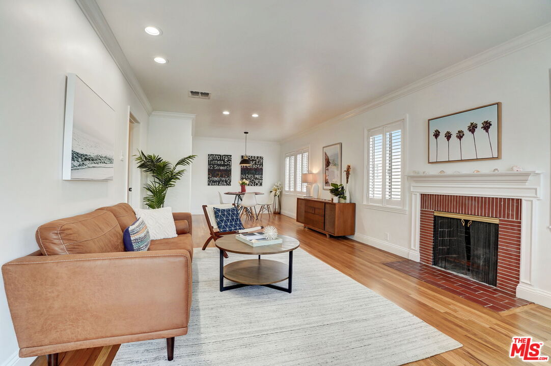 6215 West 77th Street Los Angeles, CA 90045 - Photo 6 of 23 a living room with furniture and a fireplace