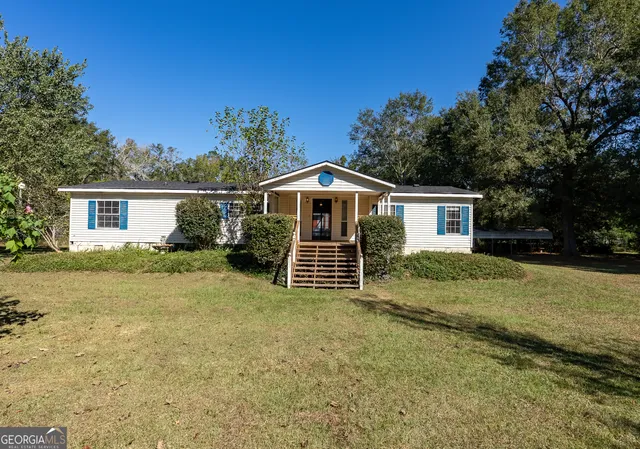 a house view with a garden space
