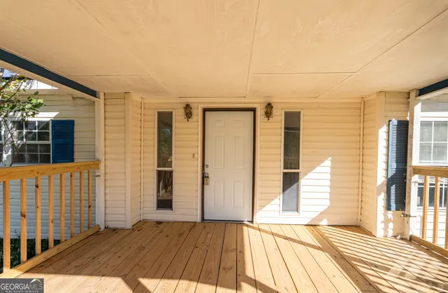 a view of a bathroom with wooden floor