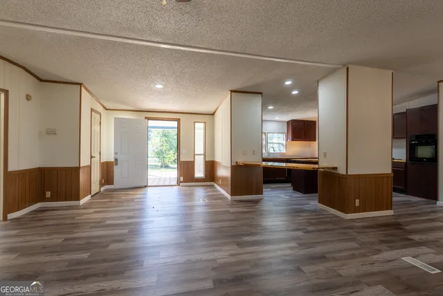 a view of kitchen with cabinets and counter space
