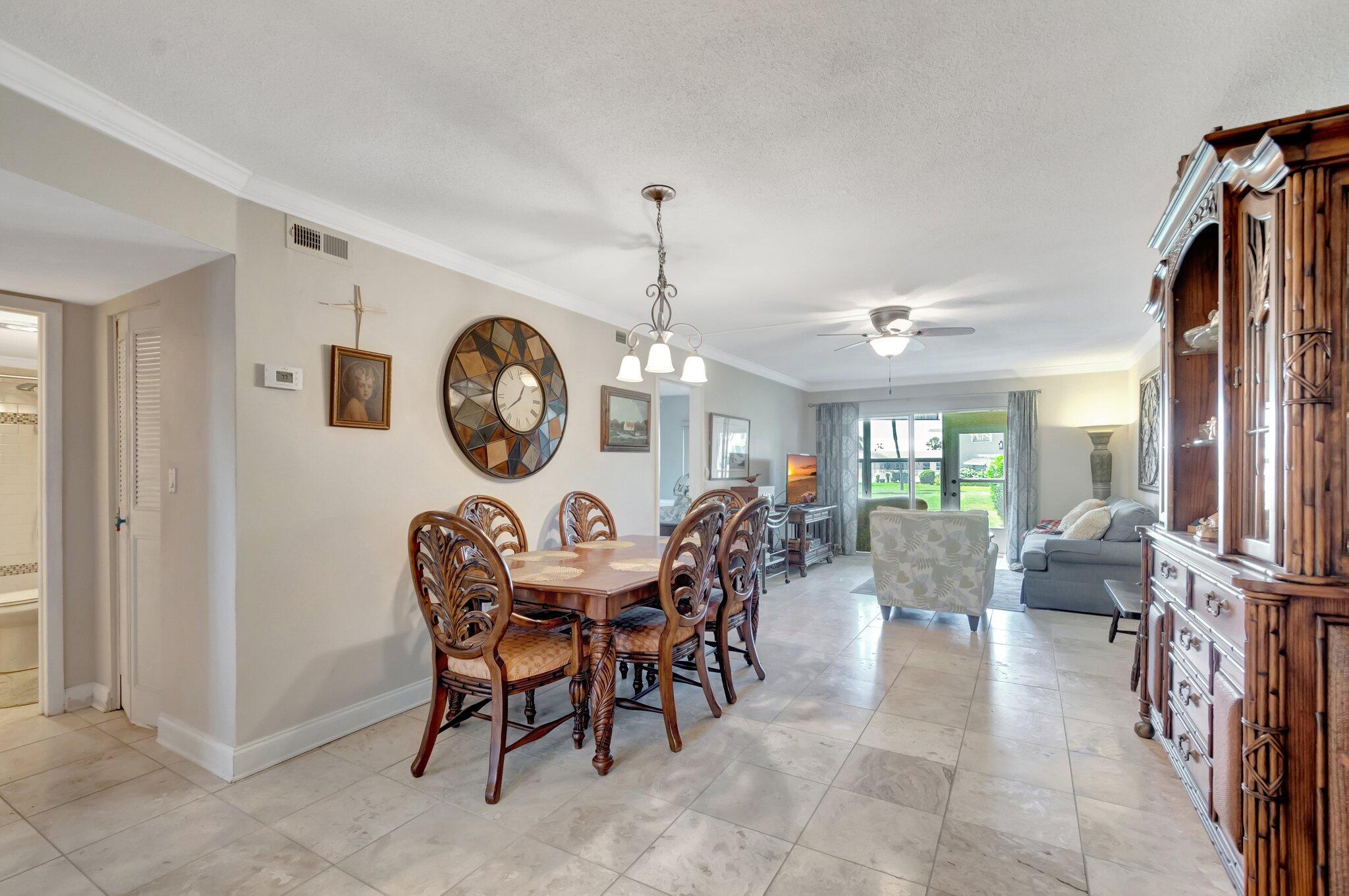 5550 North Ocean Boulevard, Unit 107 Ocean Ridge, FL 33435 - Photo 14 of 38 Dining room with doorway to bathroom