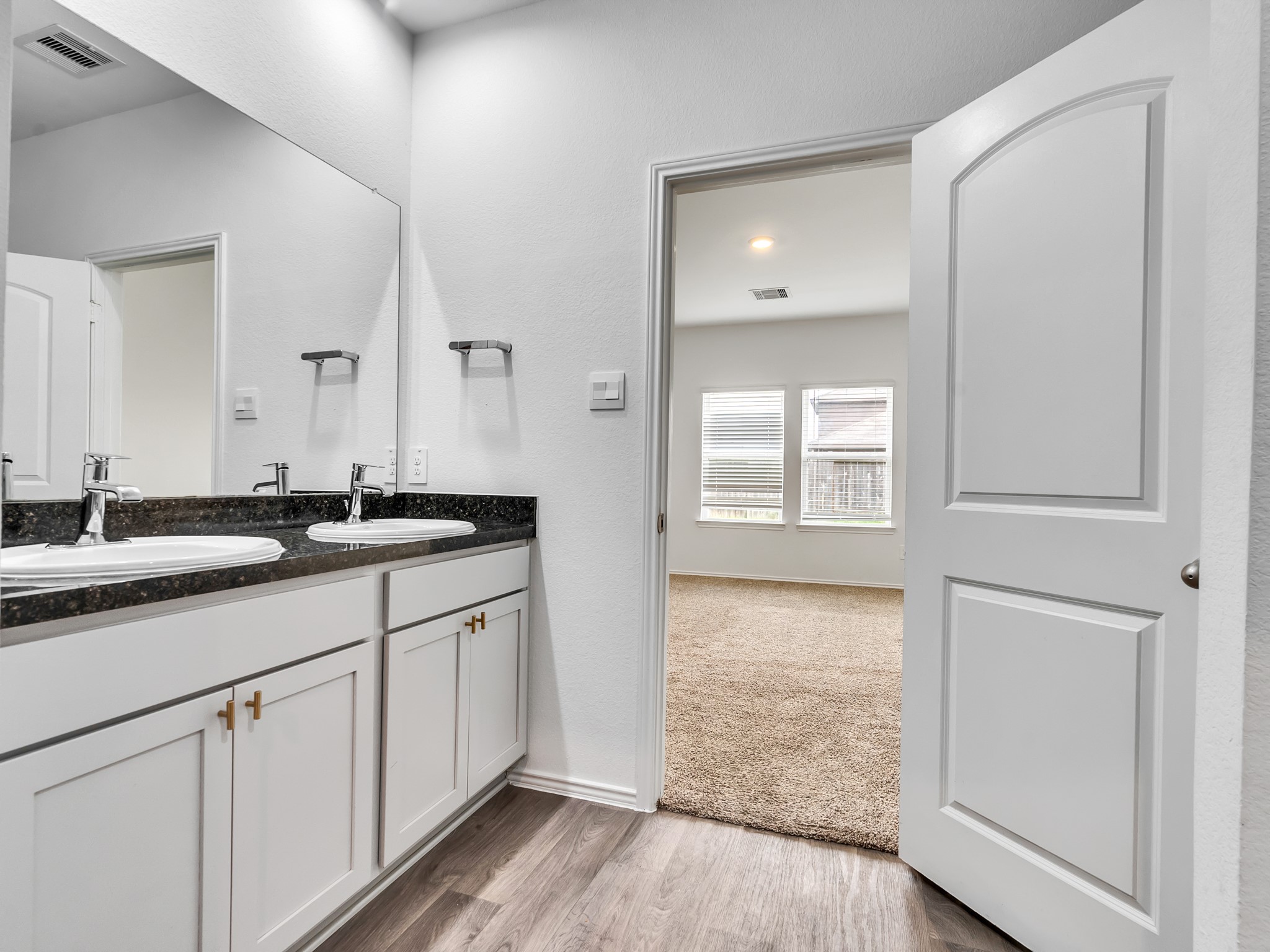 5431 Tuscany Hills Lane Spring, TX 77373 - Photo 8 of 22 a bathroom with a sink and a mirror