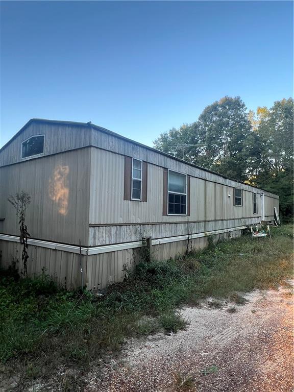 482 Kerce Road Northeast Kingston, GA 30145 - Photo 1 of 1 a backyard of a house with wooden fence