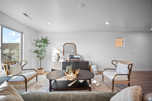 2123 Wolverine Way, Unit 2437 Washington, UT 84780 - Photo 23 of 40 Bright living area featuring a large window, recessed lighting, and wood-finish flooring