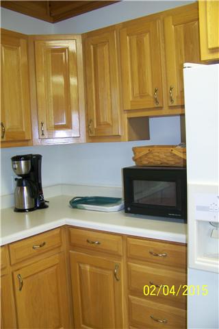 1062 Logue Road Mount Juliet, TN 37122 - Photo 7 of 20 a kitchen with granite countertop cabinets and black appliances