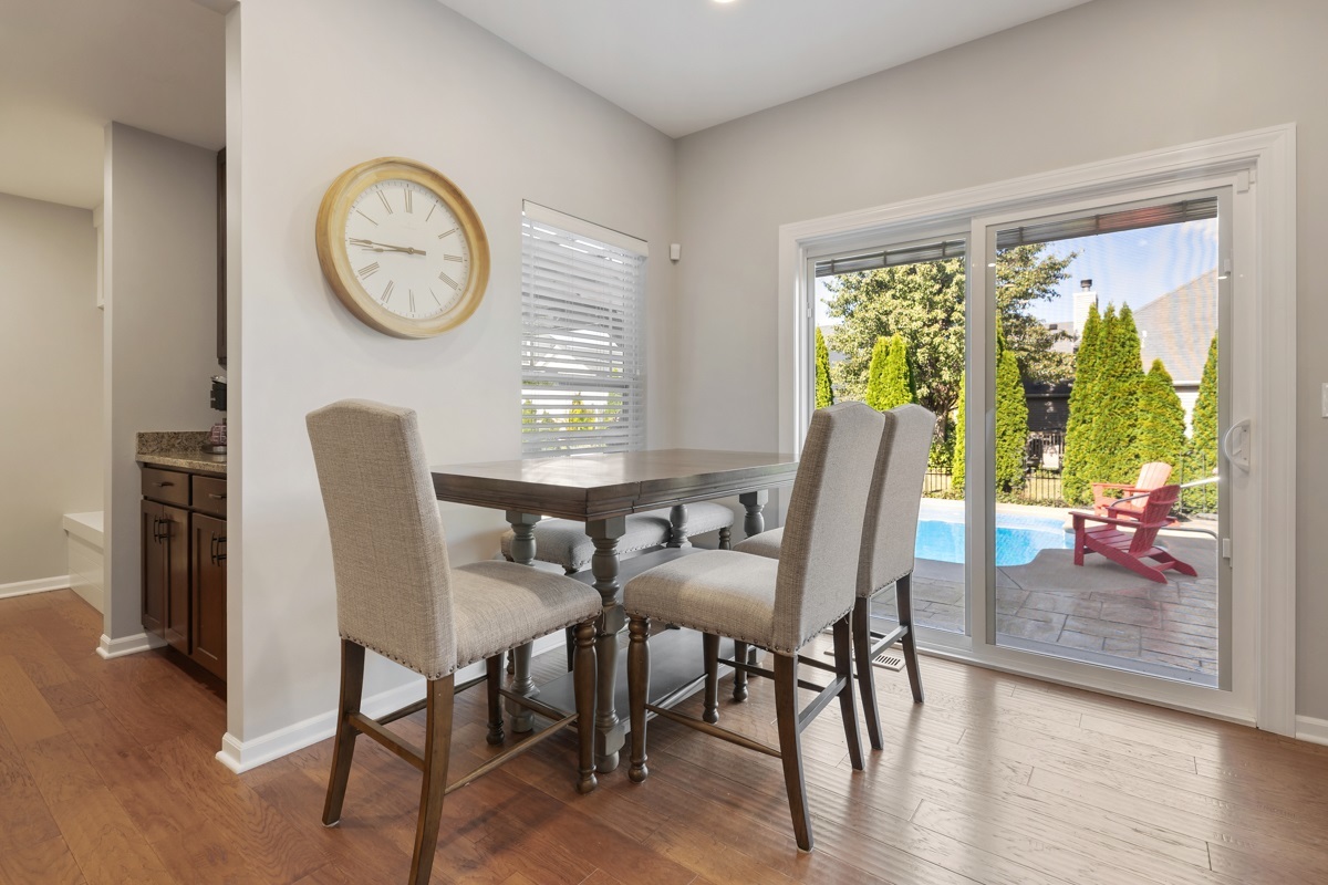 1430 Souders Avenue Elburn, IL 60119 - Photo 12 of 37 a view of a dining room with furniture window and wooden floor