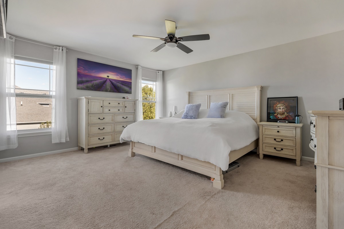 1430 Souders Avenue Elburn, IL 60119 - Photo 16 of 37 a bedroom with a bed and a tv