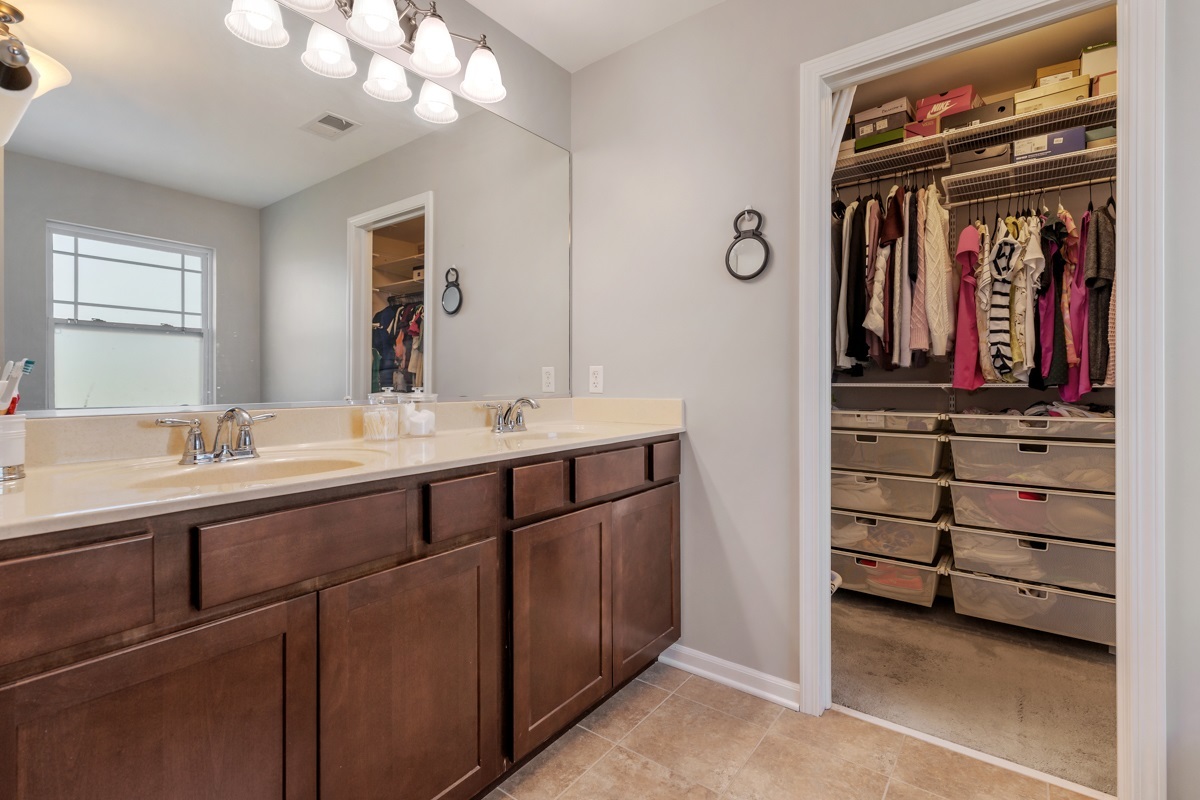 1430 Souders Avenue Elburn, IL 60119 - Photo 17 of 37 a bathroom with a double vanity sink and a mirror