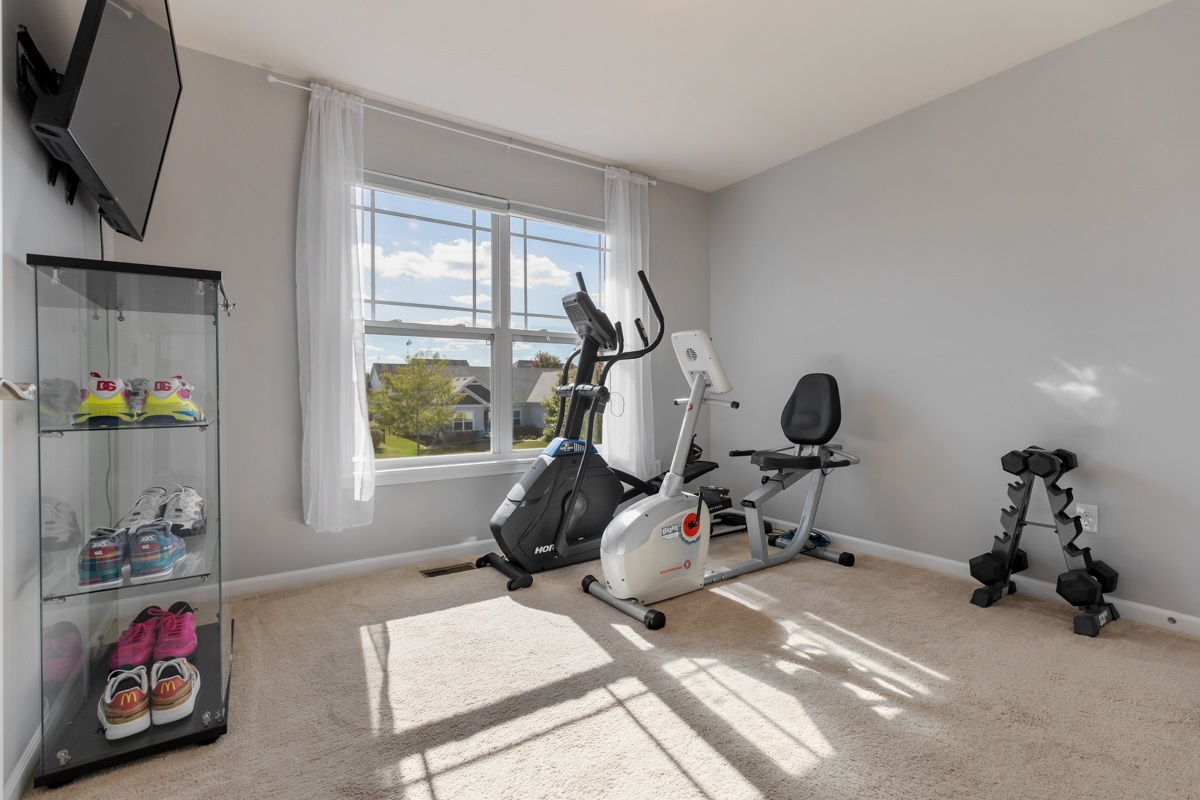 1430 Souders Avenue Elburn, IL 60119 - Photo 20 of 37 a room with gym equipment and a window