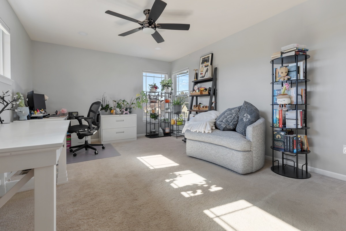 1430 Souders Avenue Elburn, IL 60119 - Photo 21 of 37 a living room with furniture and a gym machine with the view of kitchen