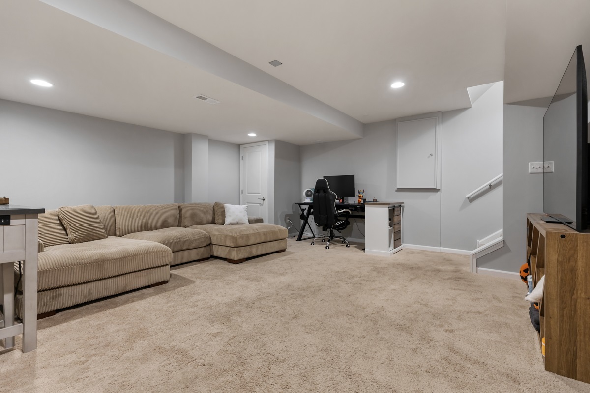 1430 Souders Avenue Elburn, IL 60119 - Photo 23 of 37 a living room with furniture and a flat screen tv