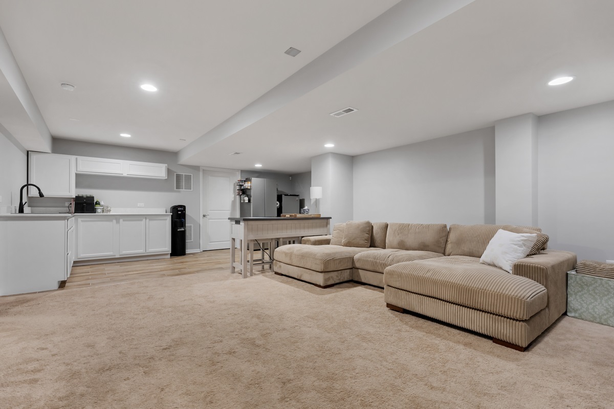 1430 Souders Avenue Elburn, IL 60119 - Photo 24 of 37 a living room with furniture and view of kitchen