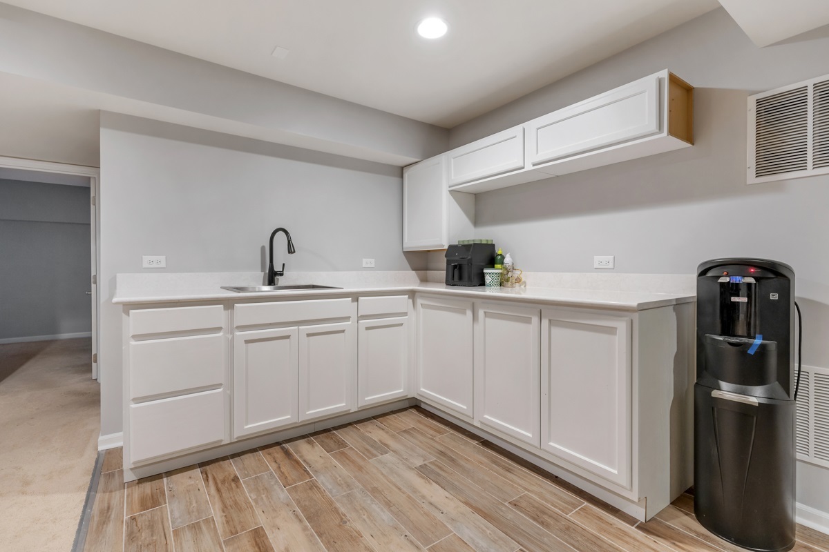 1430 Souders Avenue Elburn, IL 60119 - Photo 26 of 37 a kitchen with a sink and refrigerator