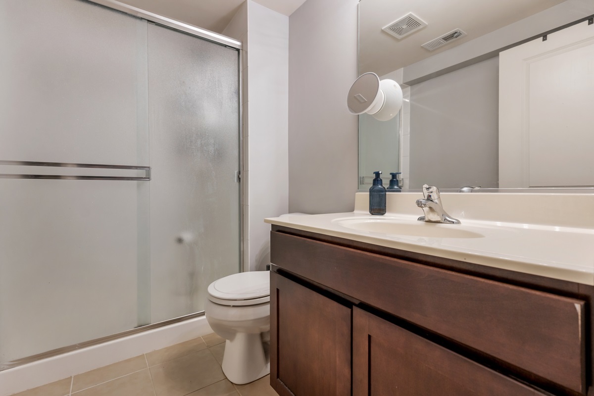 1430 Souders Avenue Elburn, IL 60119 - Photo 28 of 37 a bathroom with a sink a toilet and a mirror