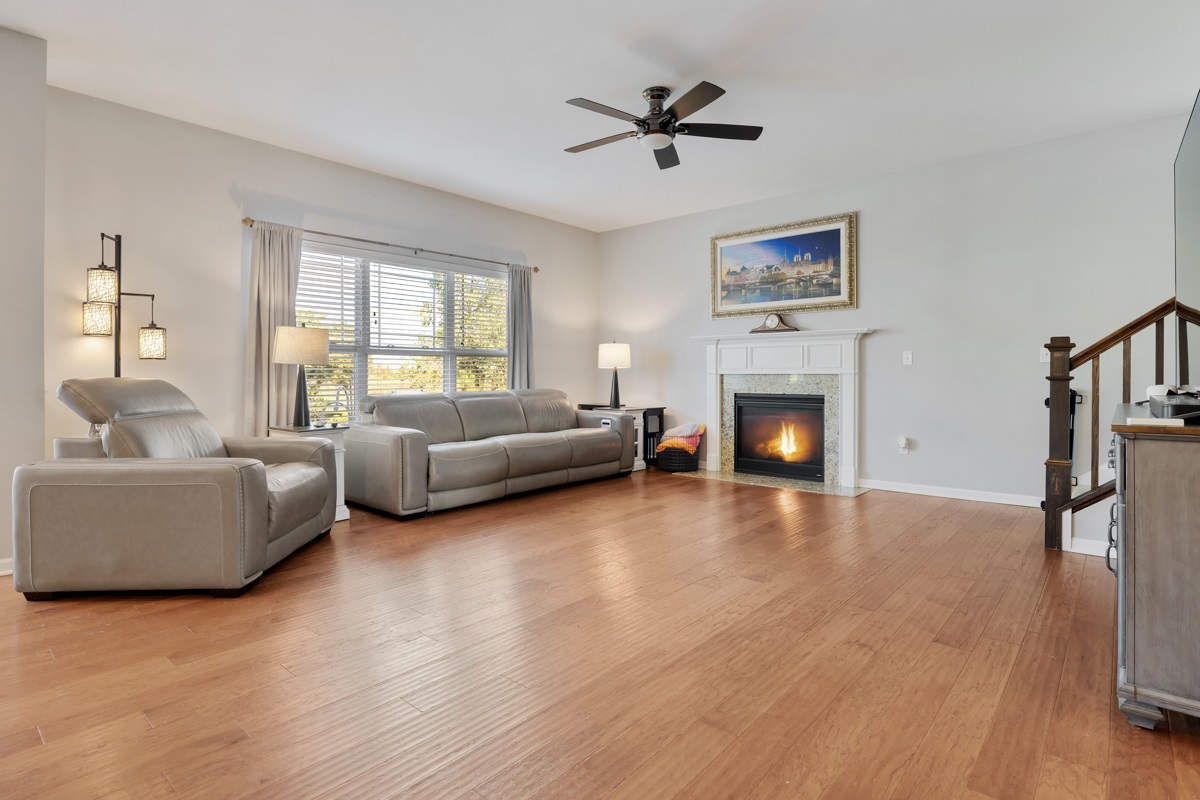 1430 Souders Avenue Elburn, IL 60119 - Photo 7 of 37 a living room with furniture and a fireplace