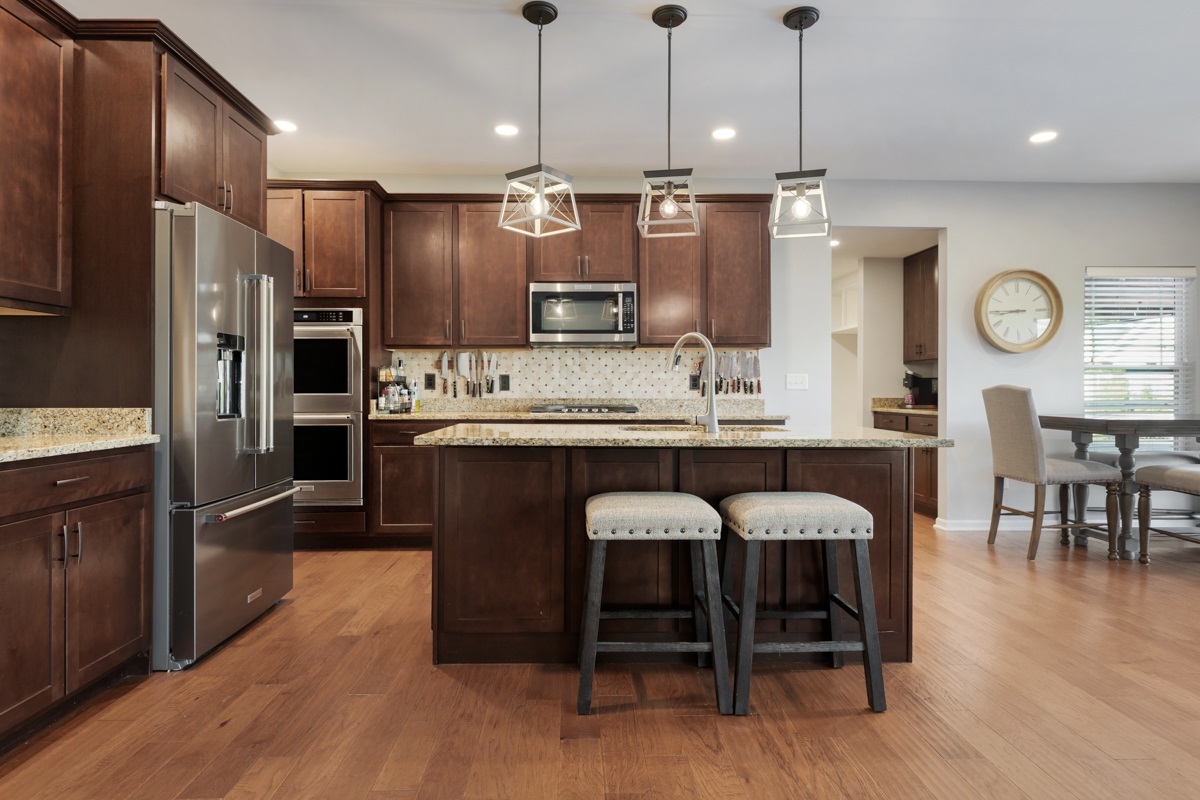 1430 Souders Avenue Elburn, IL 60119 - Photo 10 of 37 a large kitchen with a table and chairs