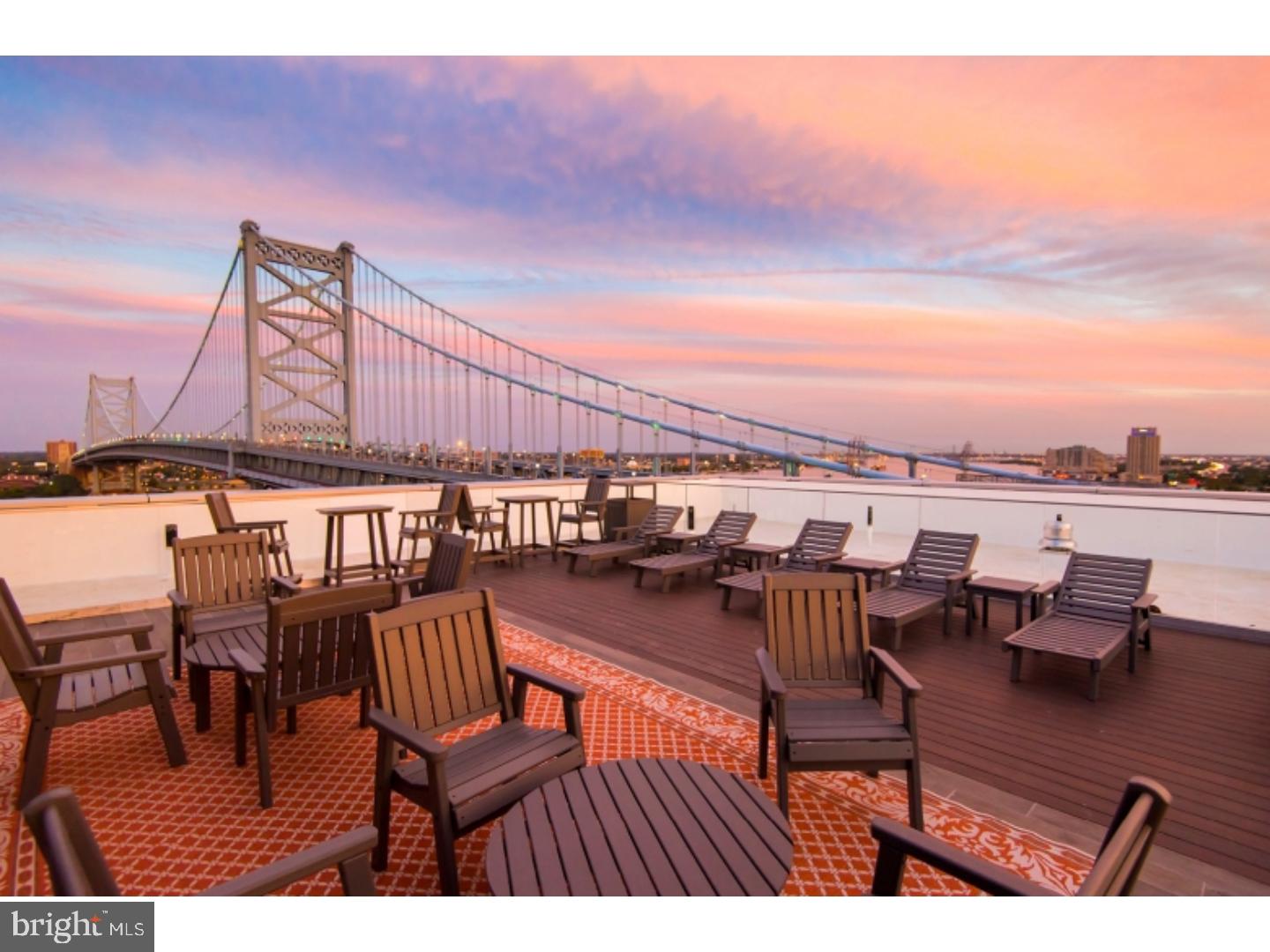 235 North Christopher Columbus Boulevard, Unit 510 Philadelphia, PA 19106 - Photo 8 of 55 a view of a chairs and table on the terrace