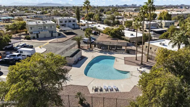 an aerial view of a house with a lake view