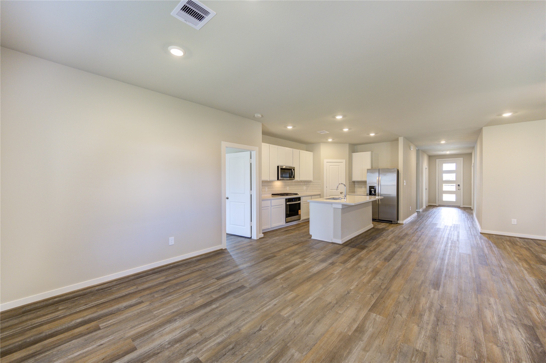 6219 Lost Rdg Lane Richmond, TX 77469 - Photo 21 of 50 a view of kitchen with wooden floor and windows