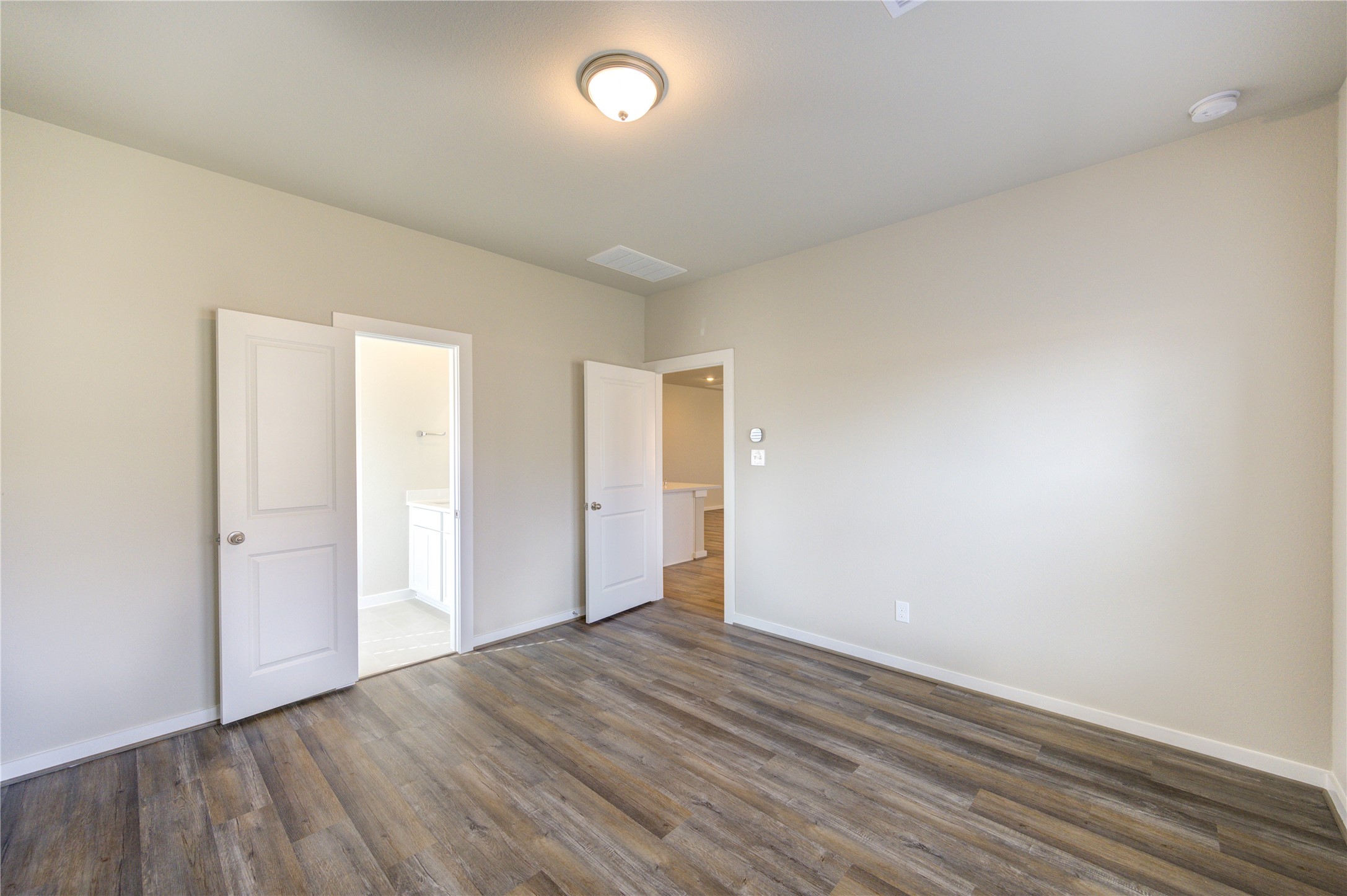 6219 Lost Rdg Lane Richmond, TX 77469 - Photo 32 of 50 an empty room with wooden floor and windows