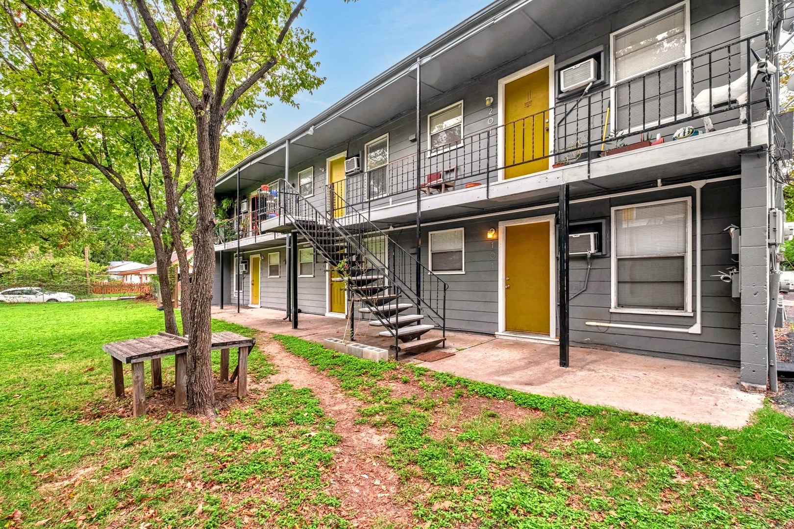 901 Springdale Road, Unit 206 Austin, TX 78702 - Photo 1 of 1 View of building exterior featuring stairs