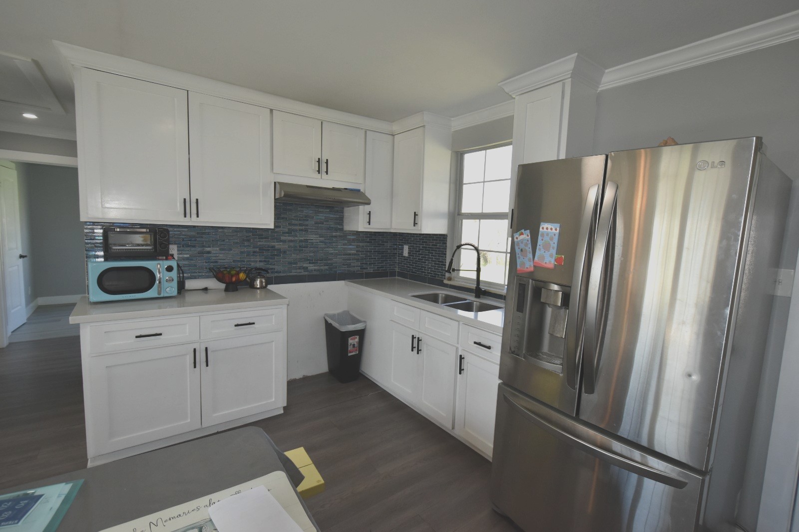 504 North Cedar Street Sweeny, TX 77480 - Photo 10 of 27 a kitchen with stainless steel appliances a refrigerator sink and cabinets