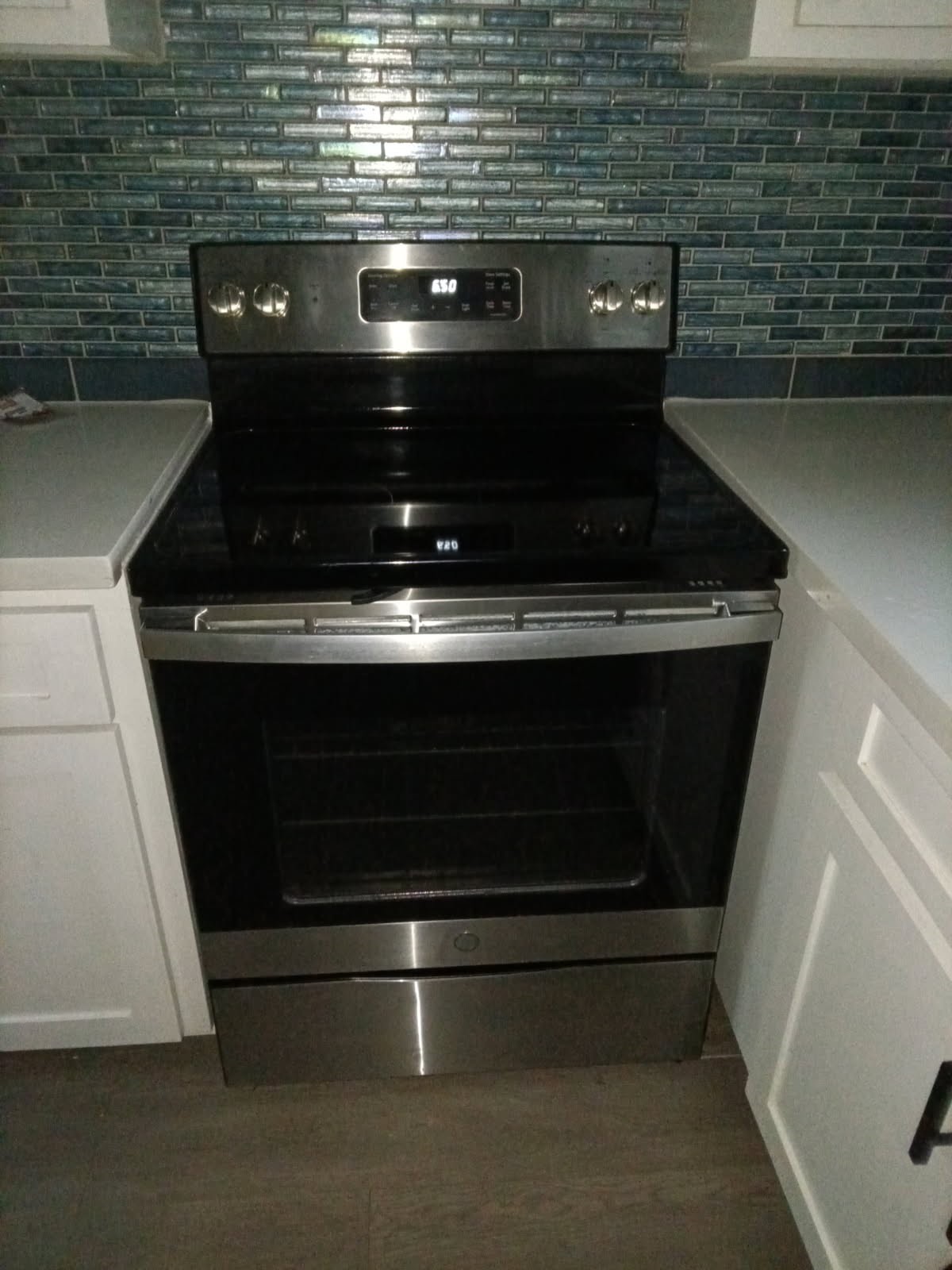504 North Cedar Street Sweeny, TX 77480 - Photo 12 of 27 a stove top oven sitting inside of a kitchen