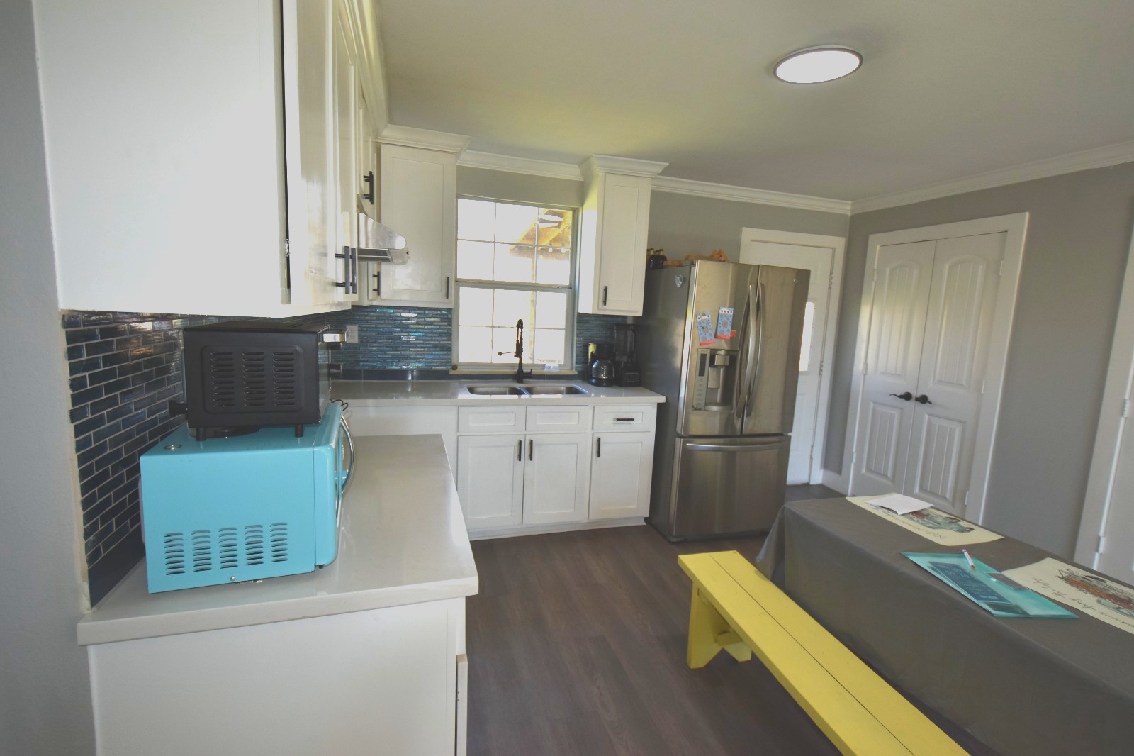 504 North Cedar Street Sweeny, TX 77480 - Photo 9 of 27 a kitchen with a sink cabinets and stainless steel appliances