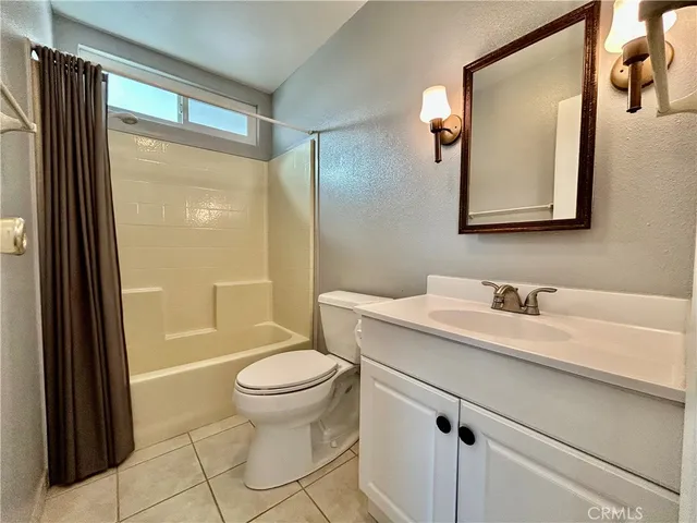 a view of a room with wooden floor and entryway