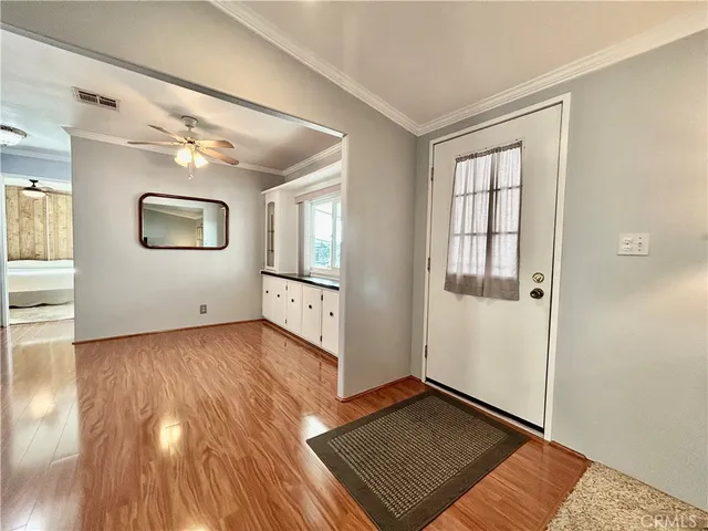 a view of a porch with furniture and a yard