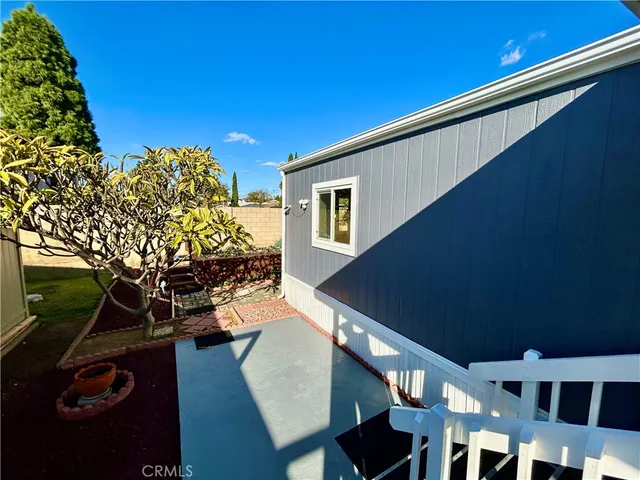 a view of a backyard with sitting area