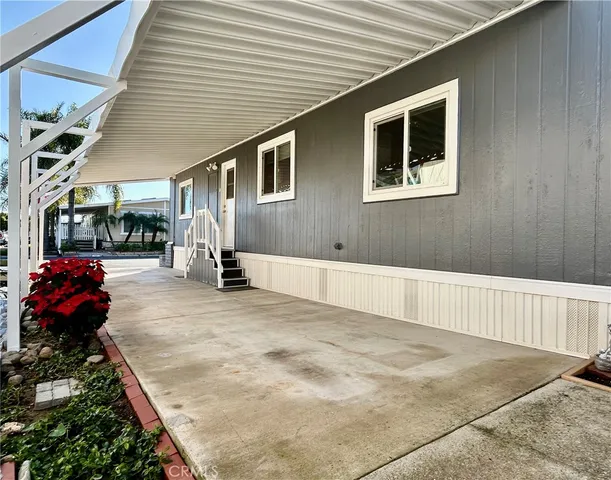 a living room with furniture and a pool table