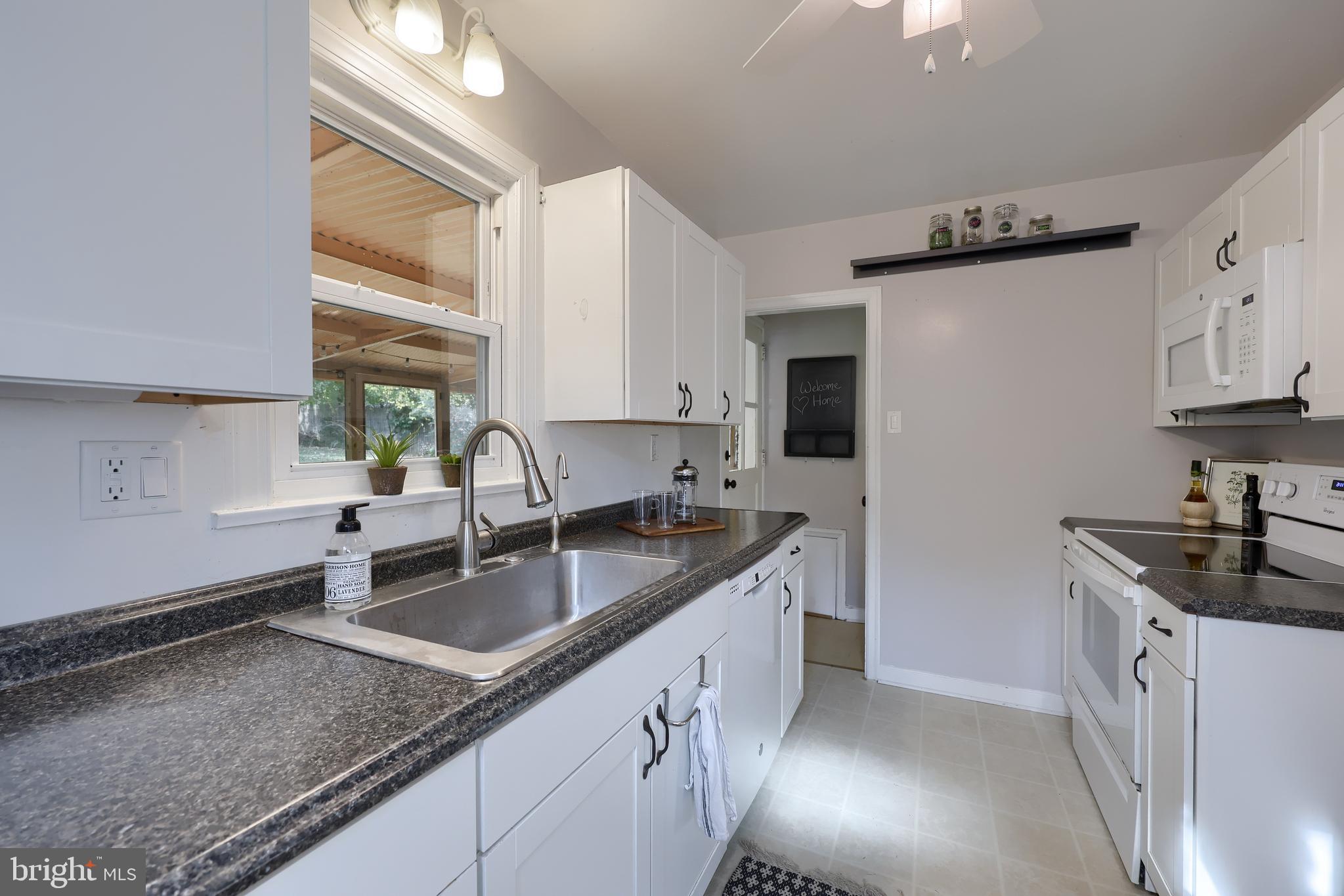 20 Willis Lane Lancaster, PA 17602 - Photo 12 of 39 a kitchen with stainless steel appliances granite countertop a sink a stove and a refrigerator