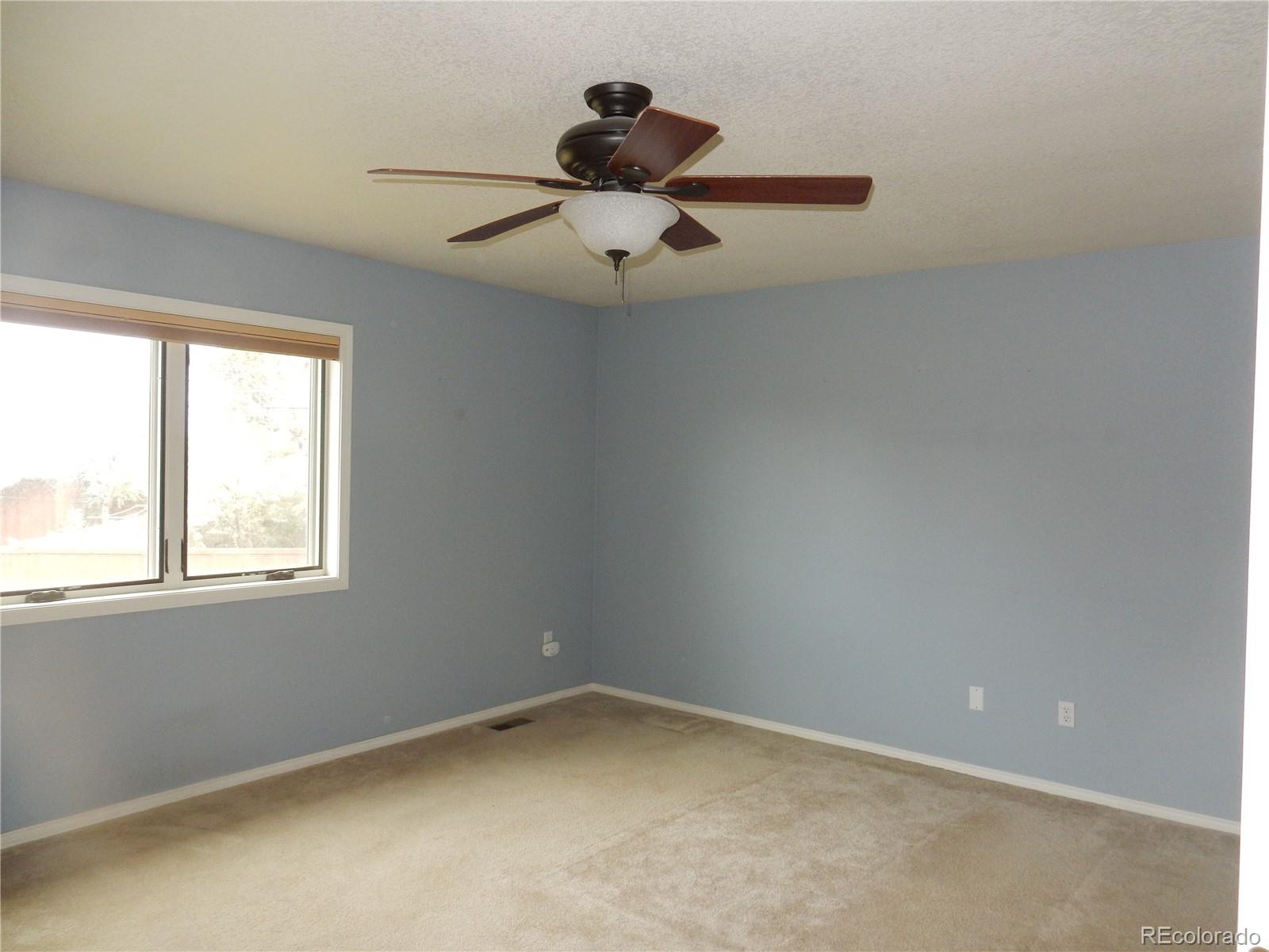 4324 Quail Street Wheat Ridge, CO 80033 - Photo 14 of 30 an empty room with a window