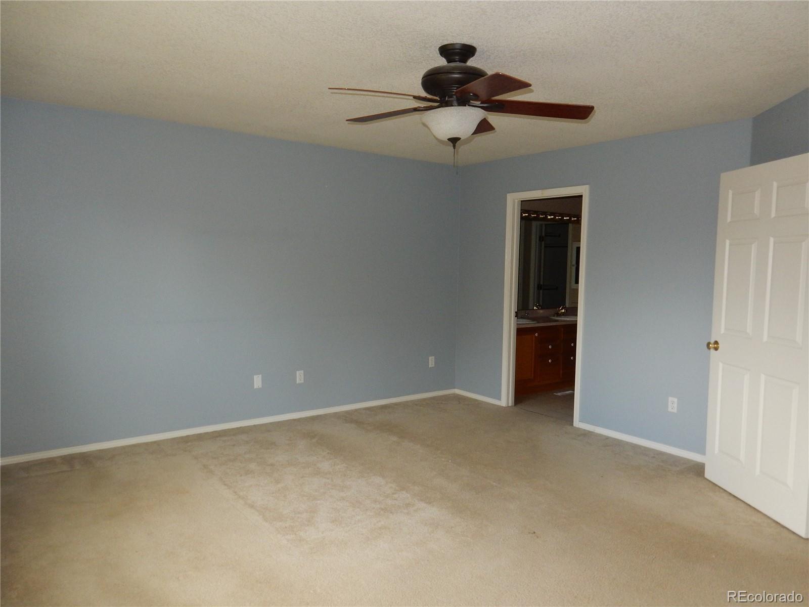 4324 Quail Street Wheat Ridge, CO 80033 - Photo 15 of 30 a view of room with a ceiling fan