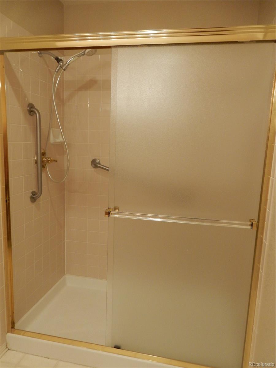 4324 Quail Street Wheat Ridge, CO 80033 - Photo 17 of 30 a bathroom with a shower