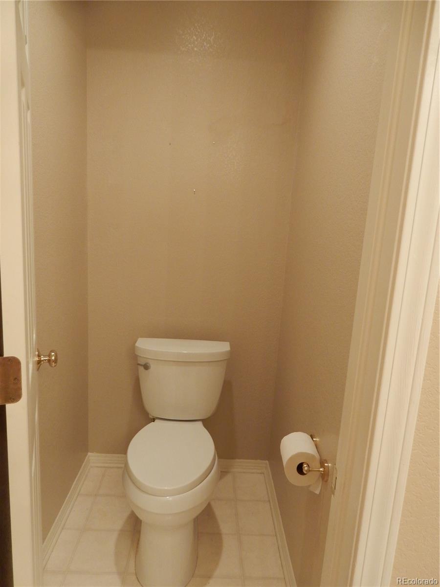 4324 Quail Street Wheat Ridge, CO 80033 - Photo 18 of 30 a bathroom with a toilet