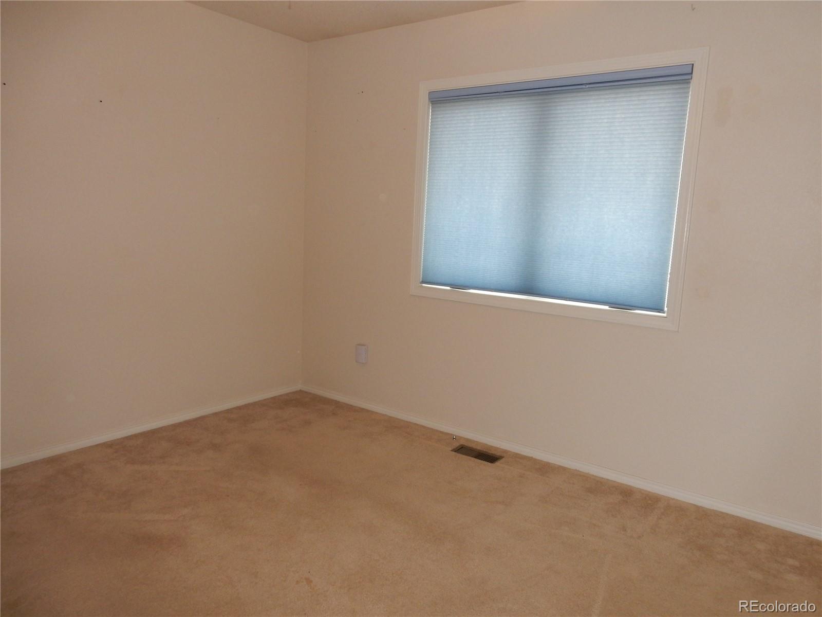 4324 Quail Street Wheat Ridge, CO 80033 - Photo 21 of 30 an empty room with a window