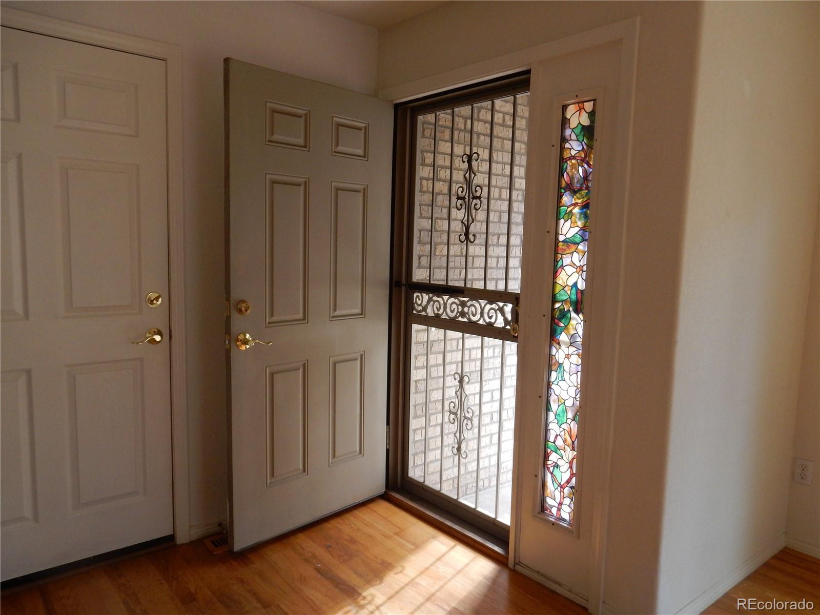 4324 Quail Street Wheat Ridge, CO 80033 - Photo 4 of 30 a view of an entryway with wooden floor