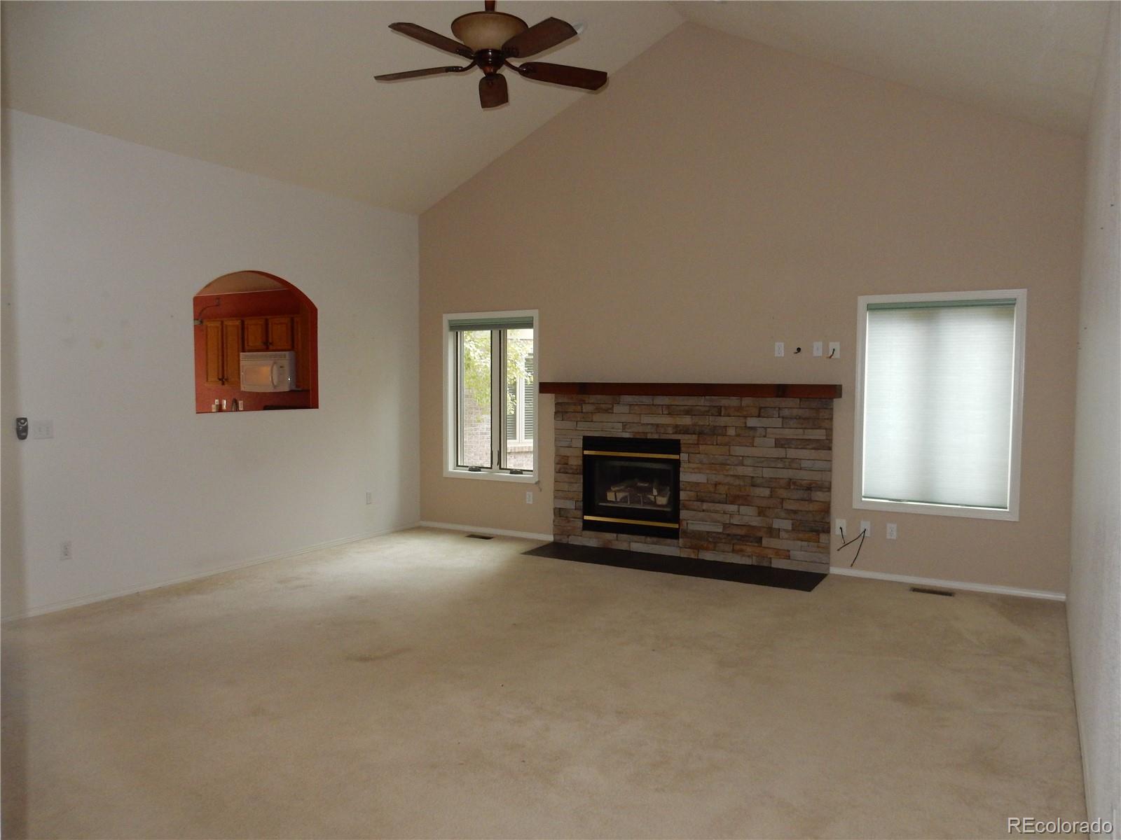 4324 Quail Street Wheat Ridge, CO 80033 - Photo 10 of 30 a view of an empty room with a fireplace
