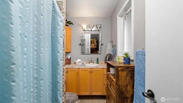 a bathroom with a sink and a mirror