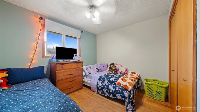 a bed room with a bed and television