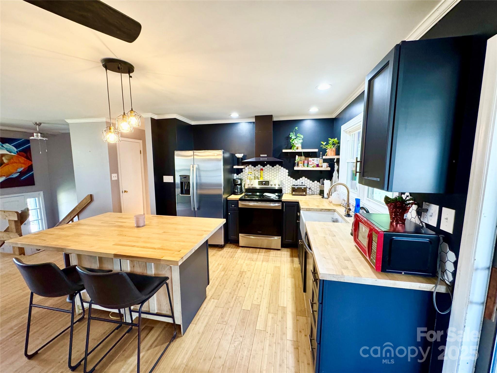 1 Spring Valley Drive Arden, NC 28704 - Photo 11 of 39 a large kitchen with kitchen island a large island in the center